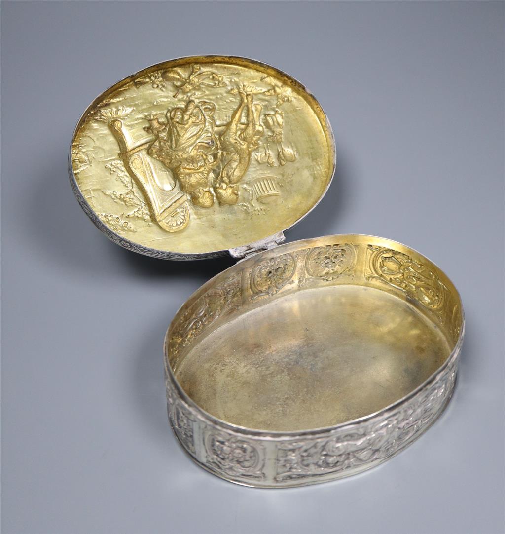 A late 19th/early 20th century German embossed 800 white metal oval box with hinged cover, 13.4cm,